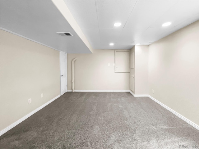 basement featuring dark colored carpet