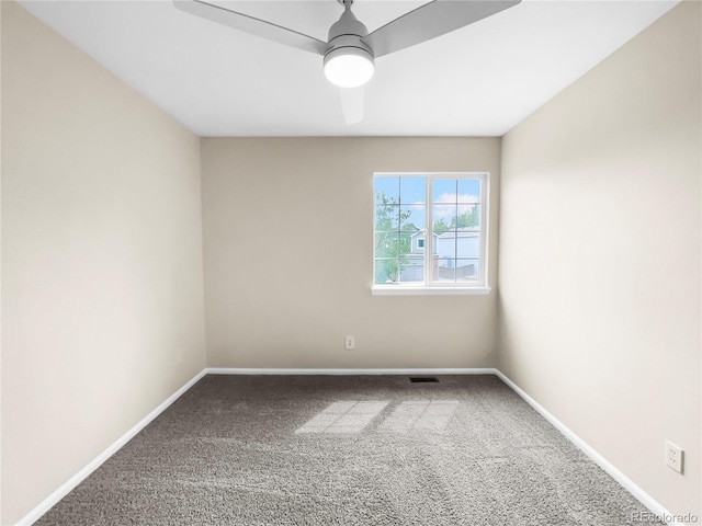 carpeted empty room featuring ceiling fan