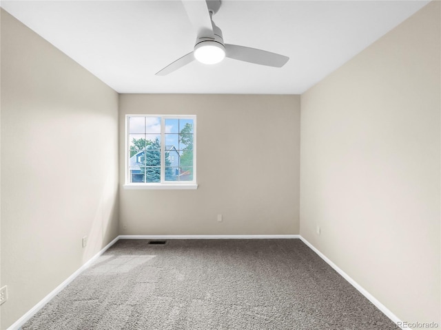 empty room with carpet and ceiling fan