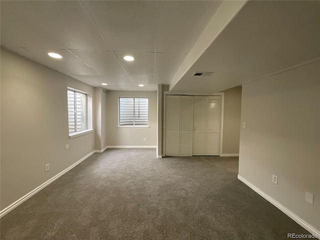 interior space featuring a drop ceiling