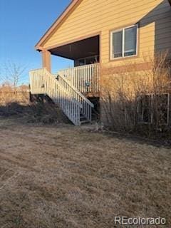 view of side of property featuring stairway