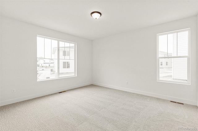 20665 E 57th Dr, Aurora, CO 80019 - unfurnished room featuring baseboards and carpet flooring