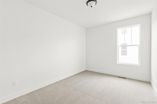 20665 E 57th Dr, Aurora, CO 80019 - spare room with baseboards and carpet