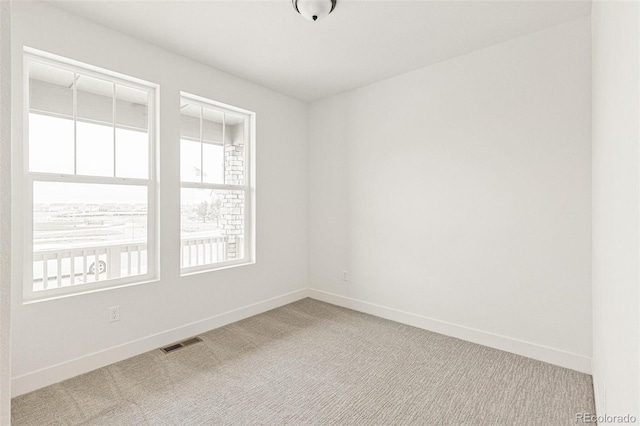20665 E 57th Dr, Aurora, CO 80019 - carpeted spare room with baseboards