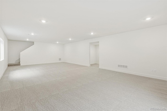 20665 E 57th Dr, Aurora, CO 80019 - finished below grade area with recessed lighting, light carpet, and baseboards