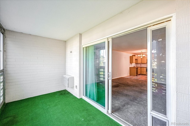 9340 E Center Ave Unit 8B, Denver, CO 80247 - unfurnished sunroom featuring a chandelier