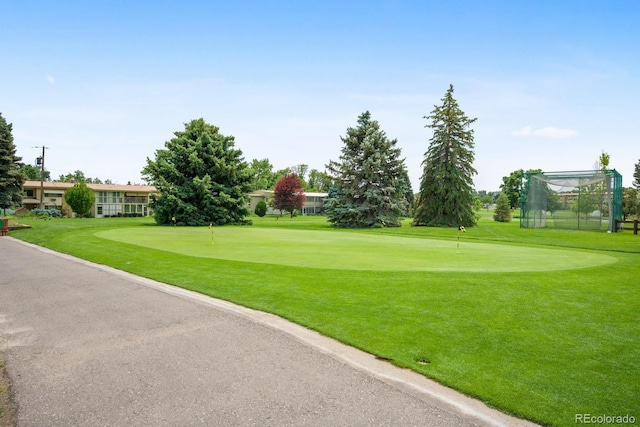 9340 E Center Ave Unit 8B, Denver, CO 80247 - view of home's community with a putting green, a lawn, and view of golf course