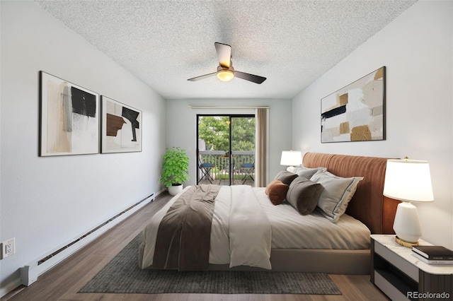 bedroom featuring a textured ceiling, a ceiling fan, wood finished floors, and a baseboard radiator