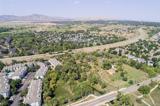 birds eye view of property with a mountain view