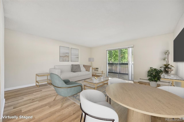 7020 E Girard Ave Unit 109, Denver, CO 80224 - living room with wood finished floors and baseboard heating