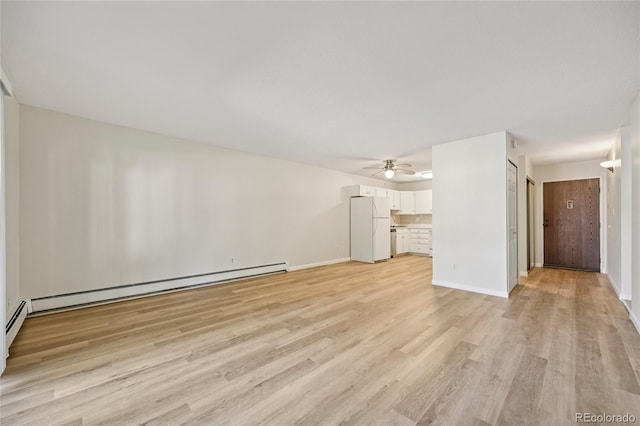 7020 E Girard Ave Unit 109, Denver, CO 80224 - unfurnished living room featuring ceiling fan, light wood-type flooring, and a baseboard radiator