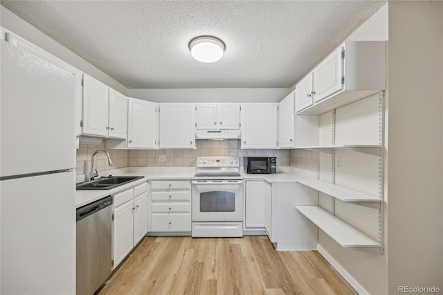 7020 E Girard Ave Unit 109, Denver, CO 80224 - kitchen with white appliances, under cabinet range hood, light wood finished floors, light countertops, and a textured ceiling