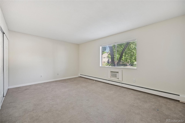 7020 E Girard Ave Unit 109, Denver, CO 80224 - empty room featuring a baseboard heating unit and carpet