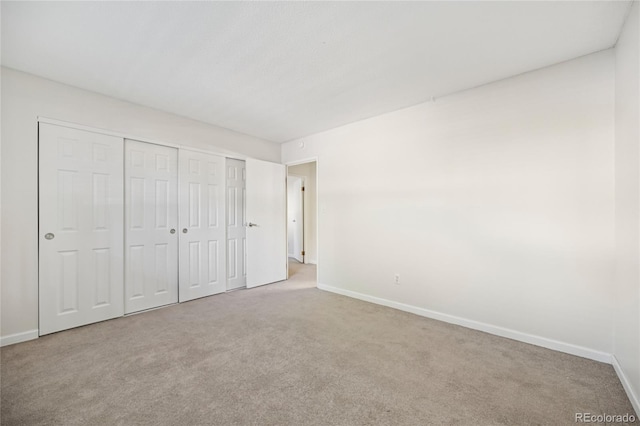 7020 E Girard Ave Unit 109, Denver, CO 80224 - unfurnished bedroom with carpet floors and a closet