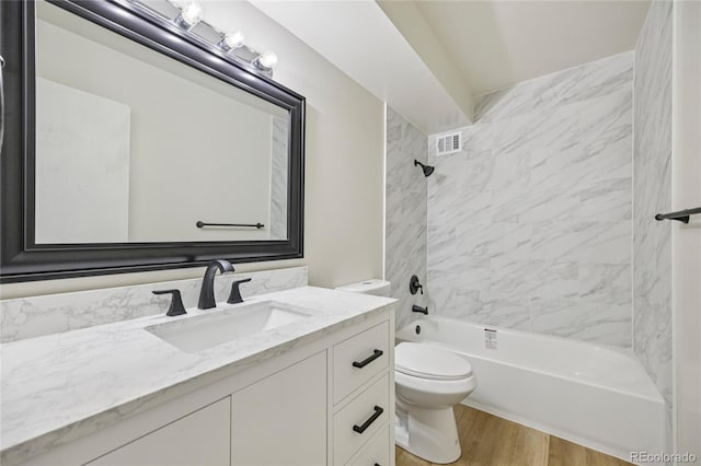 7020 E Girard Ave Unit 109, Denver, CO 80224 - full bathroom with vanity,  shower combination, and wood finished floors