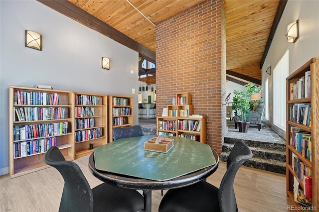 7020 E Girard Ave Unit 109, Denver, CO 80224 - dining space featuring wood ceiling, wood finished floors, and high vaulted ceiling