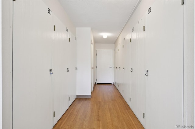7020 E Girard Ave Unit 109, Denver, CO 80224 - corridor featuring light wood-type flooring