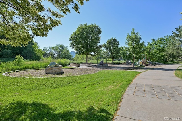 7020 E Girard Ave Unit 109, Denver, CO 80224 - view of community featuring a lawn