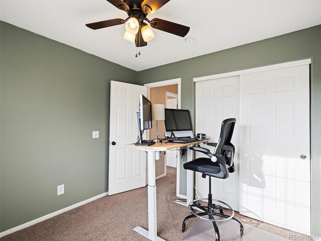 office area with carpet floors and ceiling fan