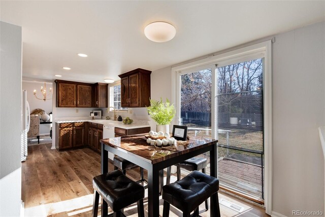 dining room featuring recessed lighting, light wood-style floors, and a chandelier