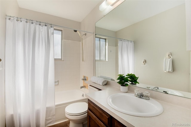 bathroom featuring toilet, vanity, and shower / bathtub combination with curtain