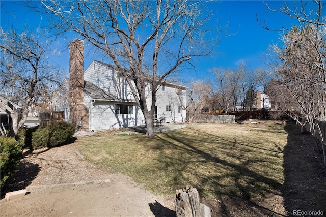 view of yard with a fenced backyard and a patio