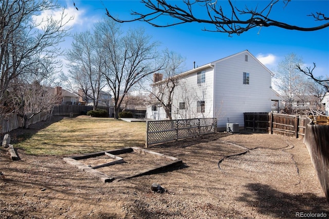 view of property exterior with a yard and a fenced backyard