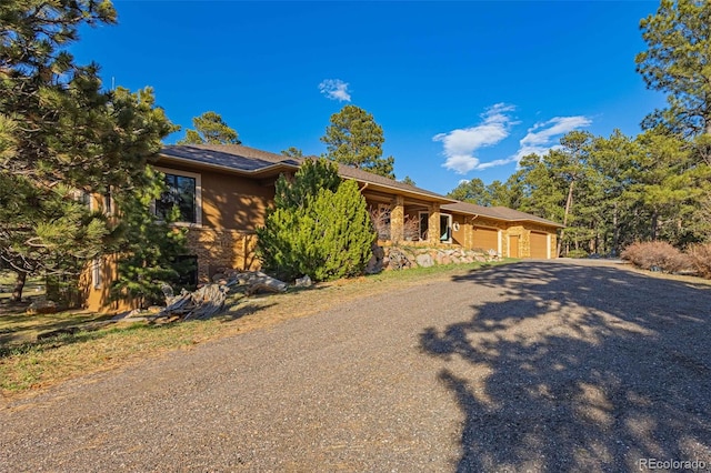 17675 State Highway 83, Colorado Springs, CO 80908 - view of front facade featuring a garage and driveway