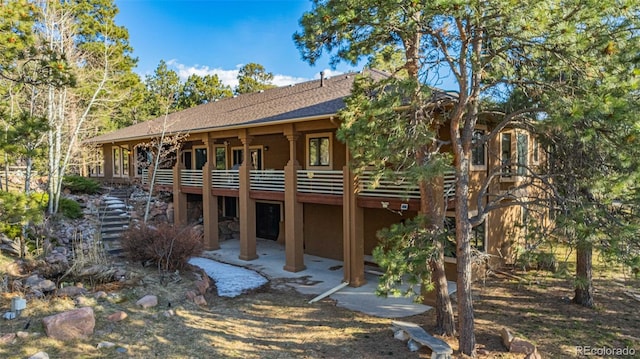 17675 State Highway 83, Colorado Springs, CO 80908 - back of house with a patio area and a shingled roof
