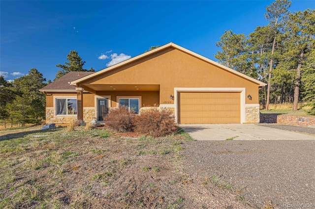 17675 State Highway 83, Colorado Springs, CO 80908 - ranch-style house featuring stone siding, stucco siding, driveway, and an attached garage
