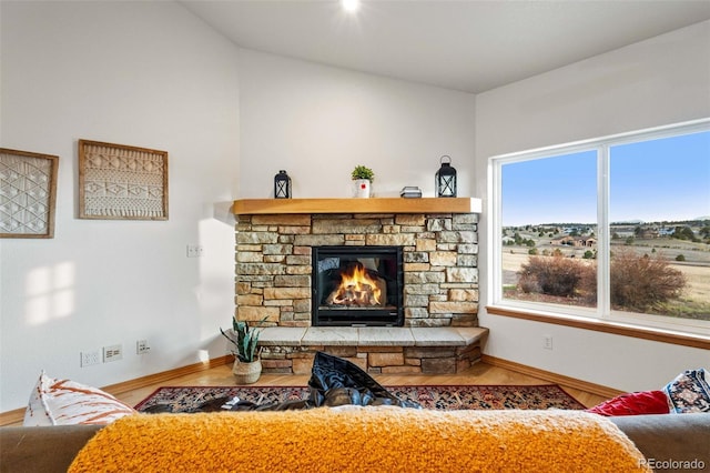 17675 State Highway 83, Colorado Springs, CO 80908 - living room with a stone fireplace and wood finished floors