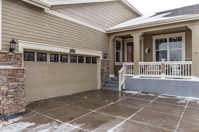 property entrance featuring a porch and a garage