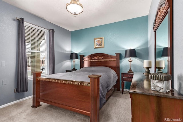 bedroom featuring light carpet