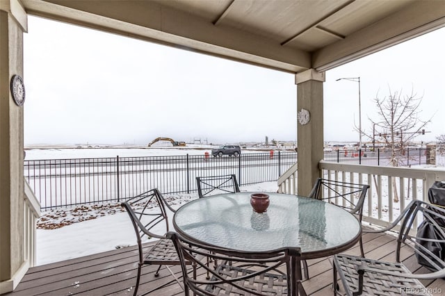 view of snow covered deck