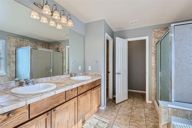 bathroom featuring vanity, tile patterned floors, and an enclosed shower