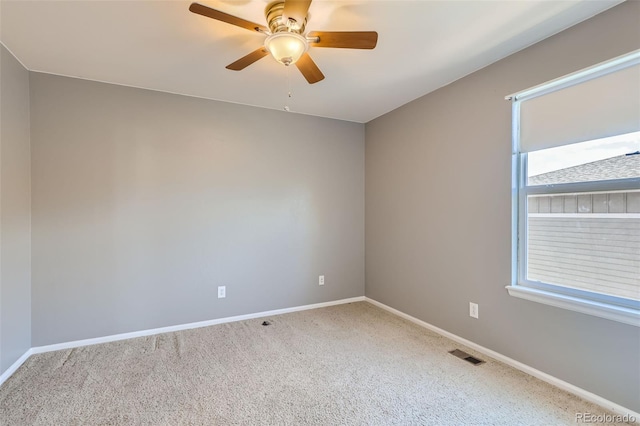 empty room with carpet and ceiling fan