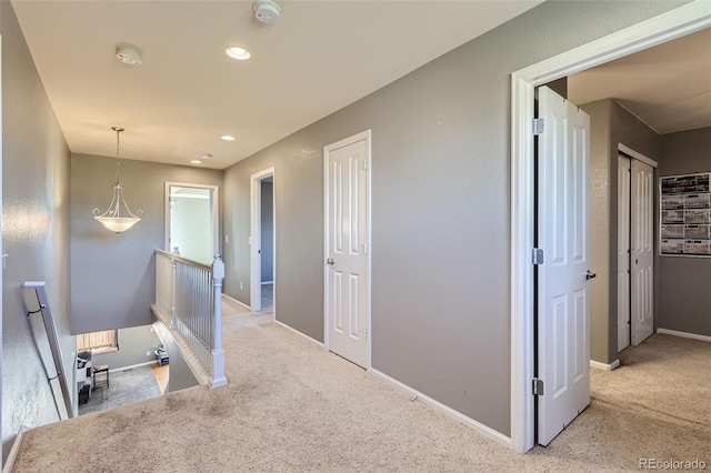 hallway with light carpet