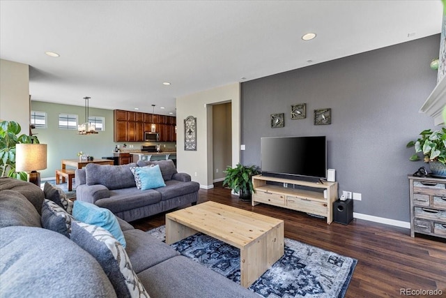 3115 Bryce Dr, Fort Collins, CO 80525 - living area with dark wood-style floors, a chandelier, and recessed lighting