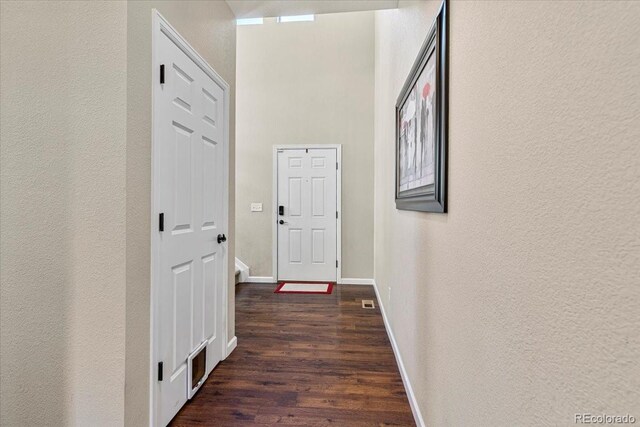 3115 Bryce Dr, Fort Collins, CO 80525 - hallway with wood finished floors and a textured wall