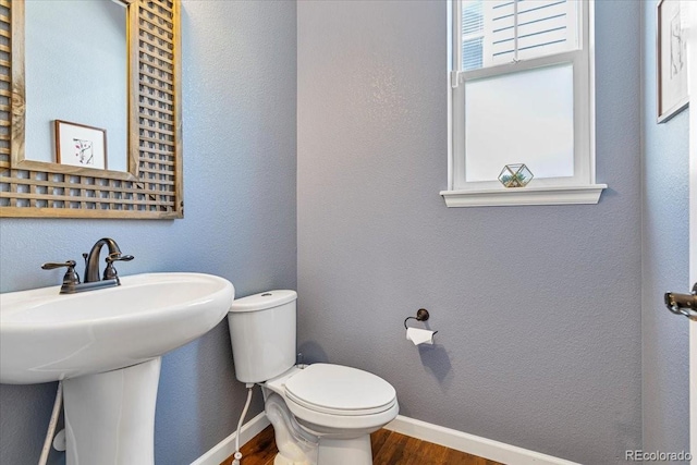 3115 Bryce Dr, Fort Collins, CO 80525 - half bath with wood finished floors and toilet