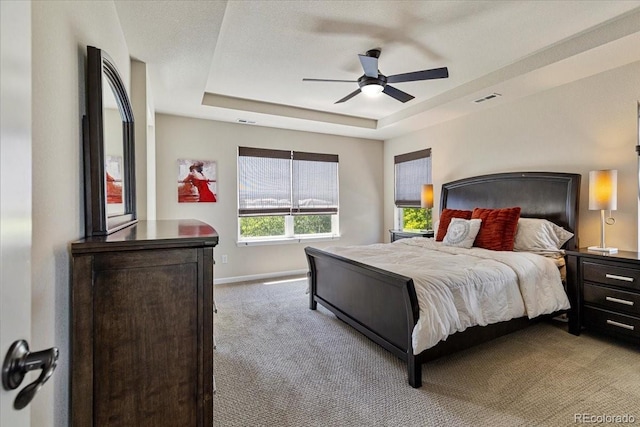 3115 Bryce Dr, Fort Collins, CO 80525 - carpeted bedroom with a raised ceiling and a ceiling fan