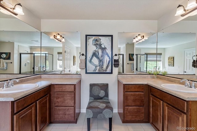 3115 Bryce Dr, Fort Collins, CO 80525 - full bath featuring two vanities, a stall shower, and tile patterned flooring