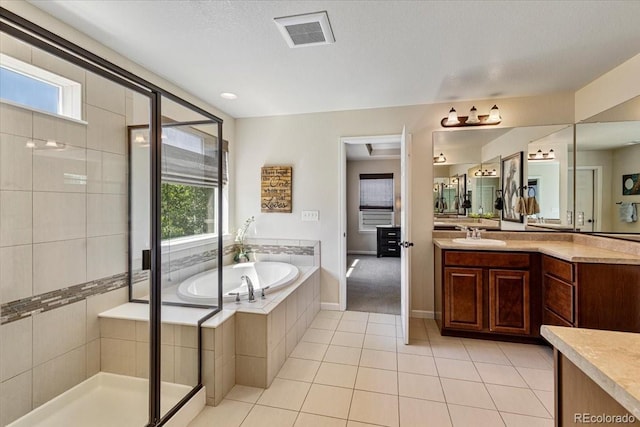 3115 Bryce Dr, Fort Collins, CO 80525 - bathroom featuring vanity, a bath, a shower stall, and tile patterned flooring