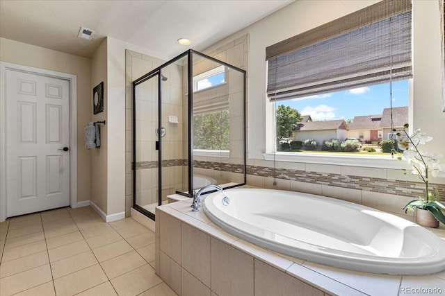 3115 Bryce Dr, Fort Collins, CO 80525 - bathroom with a bath, a stall shower, and tile patterned flooring