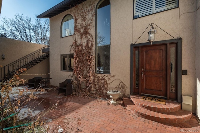 doorway to property with a patio area