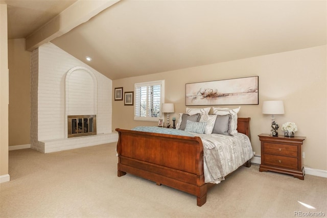 carpeted bedroom featuring a brick fireplace, a baseboard radiator, and lofted ceiling with beams