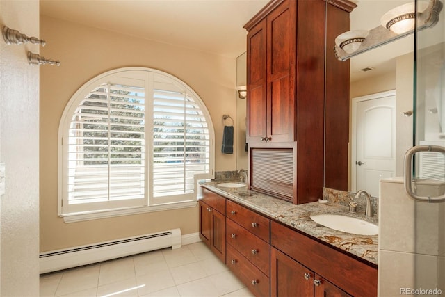 bathroom featuring tile patterned flooring, a baseboard radiator, and vanity