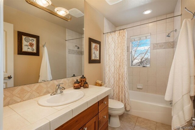 full bathroom with toilet, tile patterned floors, vanity, and shower / bathtub combination with curtain