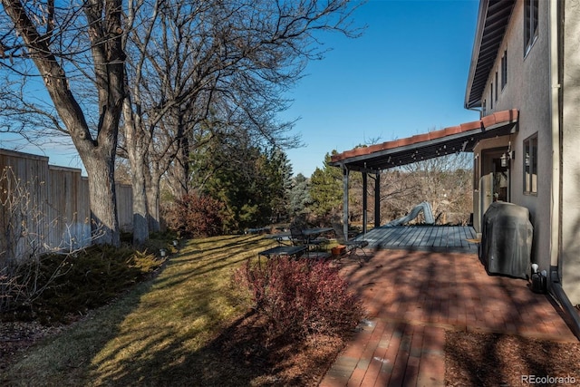 view of yard with a wooden deck