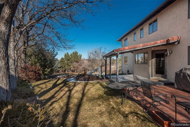 view of yard with a deck